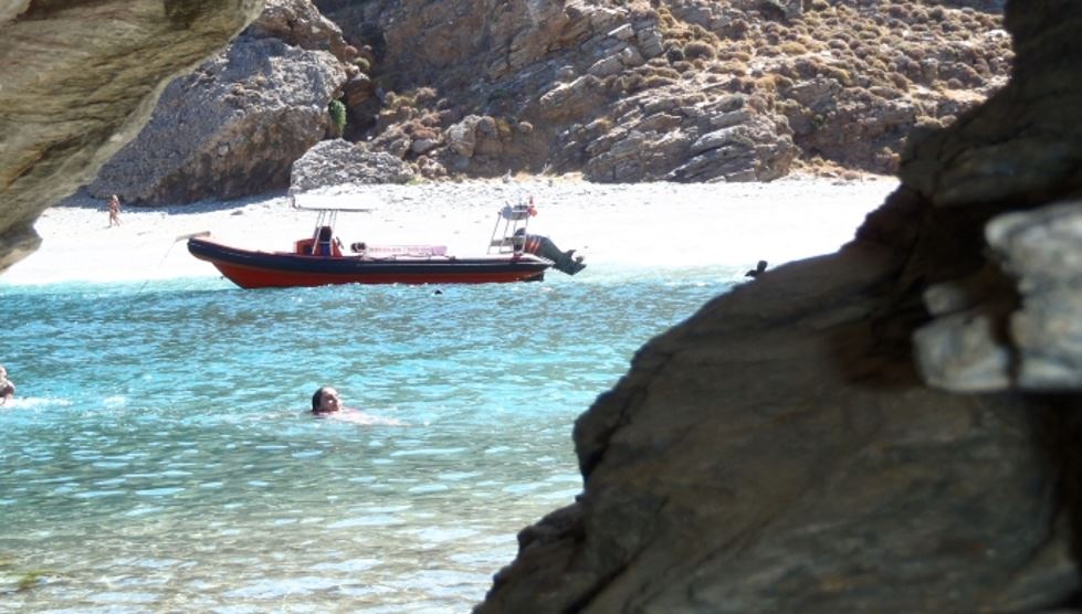 swimming in remote beaches of Karystos